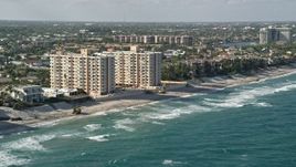 5K aerial stock footage flyby apartment buildings on the beach, Highland Beach, Florida Aerial Stock Footage | AX0032_032