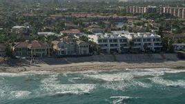 5K aerial stock footage flyby mansions, condominium complex on the beach, Highland Beach, Florida Aerial Stock Footage | AX0032_034