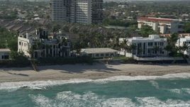 5K aerial stock footage flyby a mansion on the beach, Highland Beach, Florida Aerial Stock Footage | AX0032_035