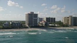5K aerial stock footage flyby an apartment building by the beach, Highland Beach, Florida Aerial Stock Footage | AX0032_037