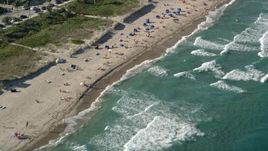 5K aerial stock footage of flying by sunbathers on the beach, Delray Beach, Florida Aerial Stock Footage | AX0032_044