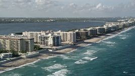 5K aerial stock footage of flying by coastal apartments and condominiums, Palm Beach, Florida Aerial Stock Footage | AX0032_062
