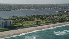 5K aerial stock footage of flying by the coastal Palm Beach Par-3 Golf Course, Palm Beach, Florida Aerial Stock Footage | AX0032_066