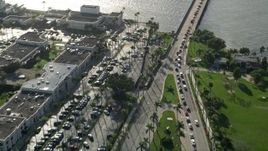 5K aerial stock footage fly over Royal Poinciana Way, reveal Flagler Memorial Bridge, Palm Beach, Florida Aerial Stock Footage | AX0032_084