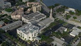 5K aerial stock footage of flying by the First Baptist Church of West Palm Beach, West Palm Beach, Florida Aerial Stock Footage | AX0032_090