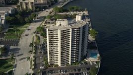 5K aerial stock footage of orbiting an apartment building, Intracoastal Waterway, West Palm Beach, Florida Aerial Stock Footage | AX0032_091