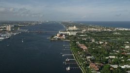 5K aerial stock footage of Flagler Memorial Bridge, Henry Morrison Flagler Museum, Palm Beach, Florida Aerial Stock Footage | AX0032_100