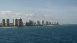 5K aerial stock footage of flying by coastal condominium complexes, Riviera Beach, Florida Aerial Stock Footage | AX0032_115
