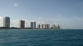 5K aerial stock footage fly over Atlantic Ocean, reveal coastal condominiums, Riviera Beach, Florida Aerial Stock Footage | AX0032_116E