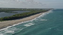 5K aerial stock footage of John D. MacArthur Beach State Park, Riviera Beach, Florida Aerial Stock Footage | AX0032_120E