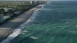 5K aerial stock footage of flying by the beach, approaching kite surfer, Juno Beach, Florida Aerial Stock Footage | AX0032_130