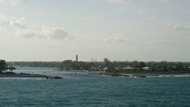 5K aerial stock footage of flying by Jupiter Inlet, Jupiter Inlet Light, Jupiter, Florida Aerial Stock Footage | AX0032_145
