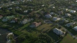 5K aerial stock footage of flying by a residential neighborhood, Stuart, Florida Aerial Stock Footage | AX0032_156