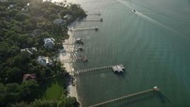 5K aerial stock footage of flying by docks along the shore, Saint Lucie Inlet, Stuart, Florida Aerial Stock Footage | AX0032_157