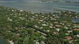 5K aerial stock footage of flying over riverfront community by the Indian River, Stuart, Florida Aerial Stock Footage | AX0033_004