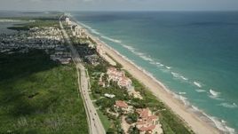 5K aerial stock footage of condominium and apartment complexes by the beach, Jensen Beach, Florida Aerial Stock Footage | AX0033_010E