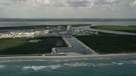 5K aerial stock footage fly away from St. Lucie Nuclear Power Plant over the ocean, Florida Aerial Stock Footage | AX0033_021