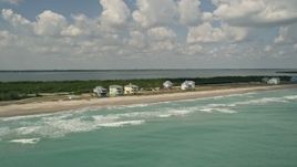 5K aerial stock footage of beachfront homes along the blue ocean waters, Fort Pierce, Florida Aerial Stock Footage | AX0033_025