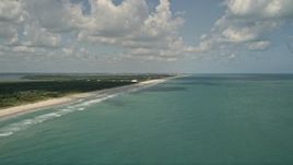 5K aerial stock footage of approaching coastal beach and blue waters, Vero Beach, Florida Aerial Stock Footage | AX0033_050