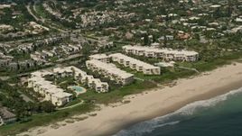 5K aerial stock footage of flying by beachside condominium complexes, Vero Beach, Florida Aerial Stock Footage | AX0033_054