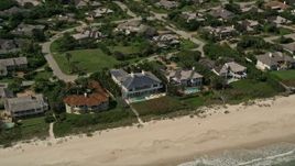 5K aerial stock footage of orbiting away from beachside mansions, Vero Beach, Florida Aerial Stock Footage | AX0033_058