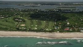 5K aerial stock footage of flying away from a beachside golf course, Vero Beach, Florida Aerial Stock Footage | AX0033_061