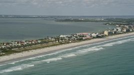 5K aerial stock footage fly along beach of Cocoa Beach, Florida Aerial Stock Footage | AX0034_007