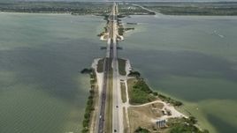 5K aerial stock footage tilt up from Bennett Causeway revealing Merritt Island, Florida Aerial Stock Footage | AX0034_021