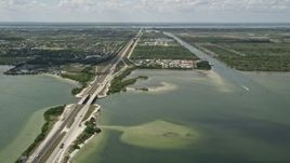 5K aerial stock footage of following the Bennett Causeway toward Merritt Island, Florida Aerial Stock Footage | AX0034_023