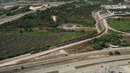 5K aerial stock footage of approaching a stopped train, Cocoa, Florida Aerial Stock Footage | AX0034_028
