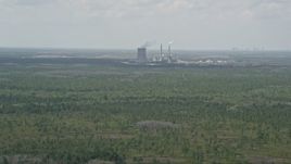 5K aerial stock footage of approaching a coal fired power generation facility, Orlando, Florida Aerial Stock Footage | AX0034_073