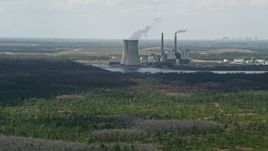 5K aerial stock footage of approaching a coal fired power generation facility, Orlando, Florida Aerial Stock Footage | AX0034_074