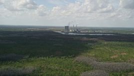 5K aerial stock footage of approaching a coal fired power generation facility, Orlando, Florida Aerial Stock Footage | AX0034_075