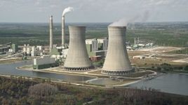 5K aerial stock footage of flying by a coal fired power generation facility, Orlando, Florida Aerial Stock Footage | AX0034_078E