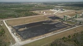 5K aerial stock footage of approaching part of a coal fired power generation facility, Orlando, Florida Aerial Stock Footage | AX0034_081