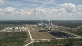 5K aerial stock footage fly away from a coal fired power generation facility, Orlando, Florida Aerial Stock Footage | AX0034_082