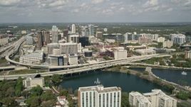 5K aerial stock footage of orbiting Lake Lucerne, approach Downtown Orlando and the Expressway, Florida Aerial Stock Footage | AX0034_092E