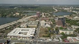 5K aerial stock footage of apartment and office buildings along North Orange Avenue, Downtown Orlando, Florida Aerial Stock Footage | AX0034_096