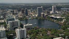 5K aerial stock footage of passing by Lake Eola and Downtown Orlando, Florida Aerial Stock Footage | AX0034_103E