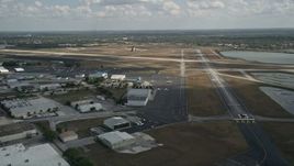 5K aerial stock footage of flying by Orlando Executive Airport, Florida Aerial Stock Footage | AX0034_115
