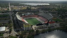 5K aerial stock footage of approaching Lake Lorna Doone and Citrus Bowl football stadium, Orlando, Florida Aerial Stock Footage | AX0035_007E