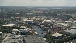 5K aerial stock footage of flying by Universal Studios Florida theme park, Orlando, Florida Aerial Stock Footage | AX0035_014E