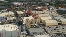 5K aerial stock footage of a roller coaster at Universal Studios Florida, Orlando, Florida Aerial Stock Footage | AX0035_016