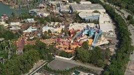 5K aerial stock footage of flying by a water ride at Universal Studios theme park, Orlando, Florida Aerial Stock Footage | AX0035_019