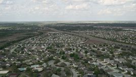 5K aerial stock footage of flying over swamps and residential neighborhoods, Clermont, Florida Aerial Stock Footage | AX0035_083E