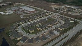 5K aerial stock footage fly over suburban homes toward an elementary school, Clermont, Florida Aerial Stock Footage | AX0035_086