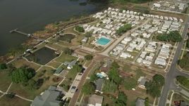 5K aerial stock footage approach mobile home park on the shore of a lake, Winter Garden, Florida Aerial Stock Footage | AX0035_111