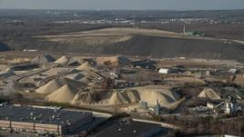 5K aerial stock footage approach a quarry in Melville, Long Island, New York, winter Aerial Stock Footage | AX0065_0003E