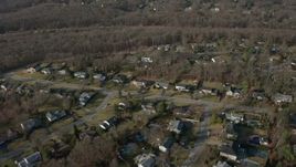 5K aerial stock footage fly over suburban homes and leafless trees in Plainview, Long Island, New York, winter Aerial Stock Footage | AX0065_0007E