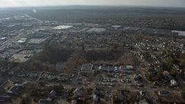 5K aerial stock footage of suburban residential neighborhood and big box stores in Syosset, Long Island, New York, winter Aerial Stock Footage | AX0065_0013E